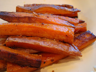 Sweet Potato Fries stacked on white plate