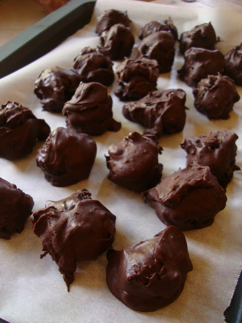 Chocolate Covered Oreo Balls on parchment paper