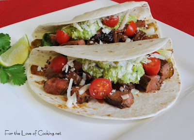 Steak, Anaheim Chile, and Scallion Tacos with Guacamole and Cotija Cheese