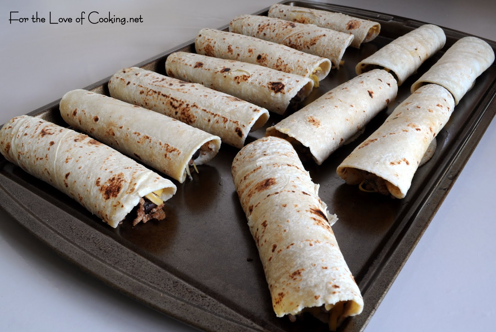 Ground Beef, Black Bean, and Cheddar Cheese Taquitos For the Love of