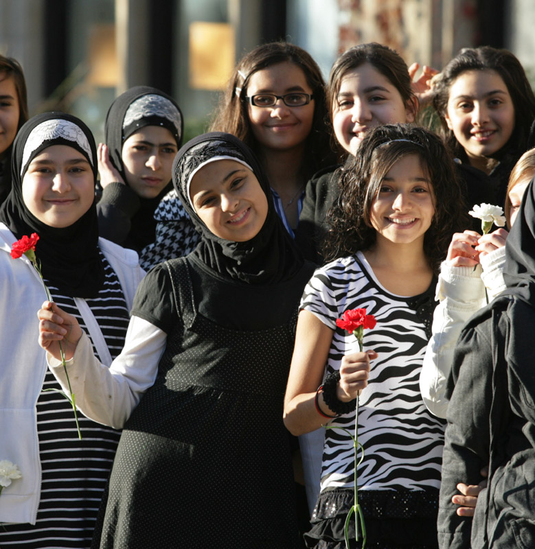 Members of the Lowrey Middle School choir hold flowers Nov