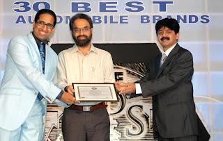 Prof. Arindam Chaudhuri (left) and Mr. Adarsh Hedge (right) giving away the 100 Most Valuable Brands awards to Mr. Ranjivjit Singh, CMO, Microsoft India Corporation (center)