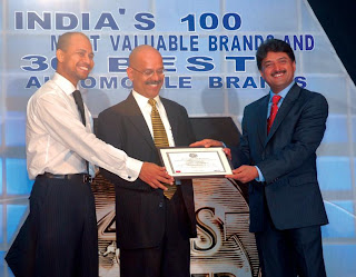 Prof A. Sandeep, Editor, Planman Media (left) & Mr. S. K. Shetty, Chairman & MD, Allcargo Global Logistics (right) giving away the Best Automobile Awards in the Two Wheeler Category to Mr. P. Sam, Group Head-Sales & Marketing, Yamaha Motor India (center)