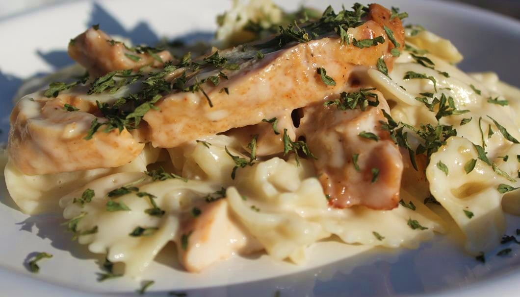 Chicken with Bow Tie Pasta and Creamy Parmesan Sauce What's Cookin' Italian Style Cuisine
