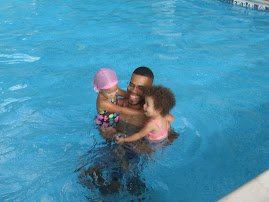 daddy and girls at the pool