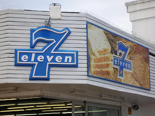 Why the emphasis on BREAD in the right sign? Who the fuck goes to 7-11 to buy bread? Oh right, Africa.