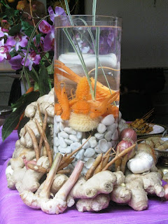 Table centrepiece of tank surrounded by ingredients