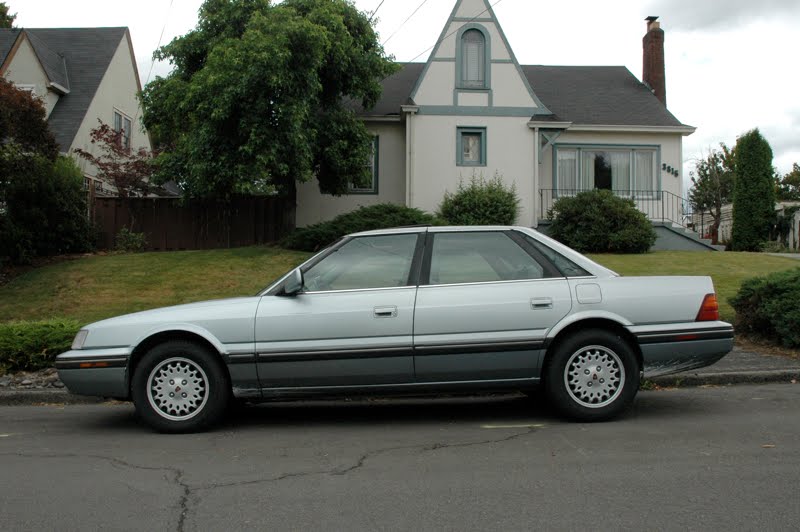 OLD PARKED CARS. 1991 Sterling 827 SL.