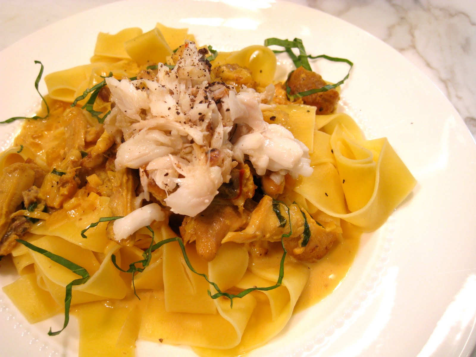 Pappardelle with Braised Chicken, Saffron Cream and Dungeness Crab