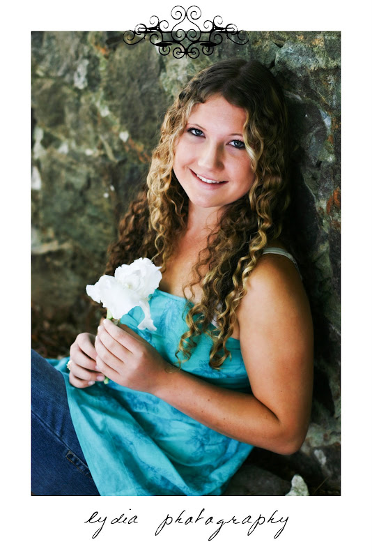 Senior girl with a white flower at Bear River senior lifestyle Empire Mine portraits in Grass Valley, California