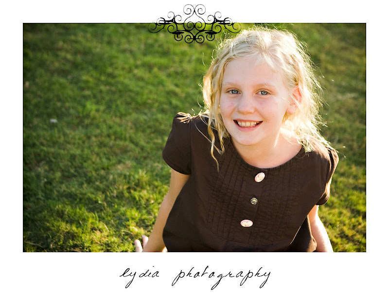 Little girl in the field at lifestyle kids portraits in San Antonio, Texas