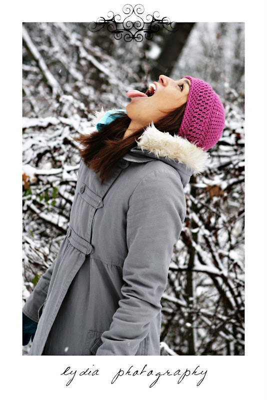Girl cathing snow with her tounge at snow lifestyle fashion portraits in Grass Valley, California