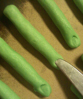Use flate end of knife to make fingernail bed