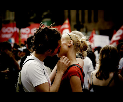 young couple kissing in the rain. kissing images of couples.