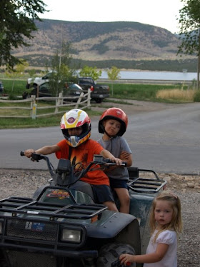 William, Ryan, and Emma riding 4-wheeler