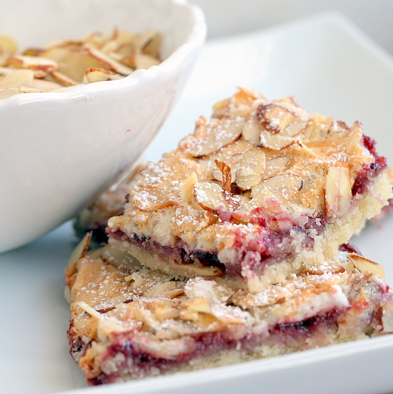 Raspberry Almond Bars Sprinkled with Flour