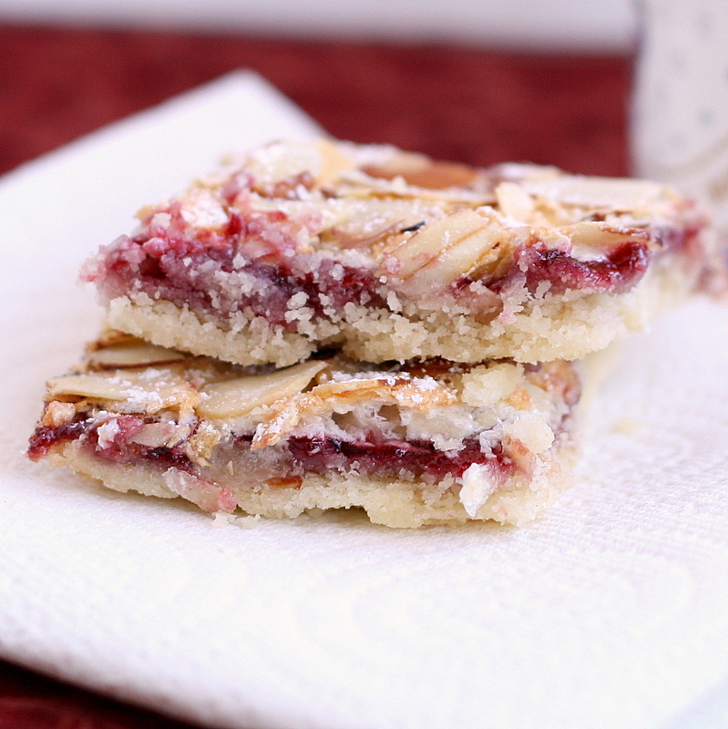 Raspberry Almond Bars Sprinkled with Flour