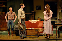Deputy File (Anthony Fusco, center) ardently woos a newly empowered Lizzie Curry (René Augesen) as her younger brother Jim (Alex Morf, left) watches hopefully in A.C.T.’s production of N. Richard Nash’s The Rainmaker.