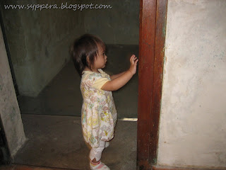 looking inside one of the prison cells inside the baracks