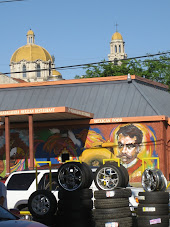 More tires and a Spanish style Catholic Cathedral in the background