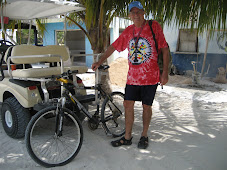 Wayne on bicycle, Billy on golf cart