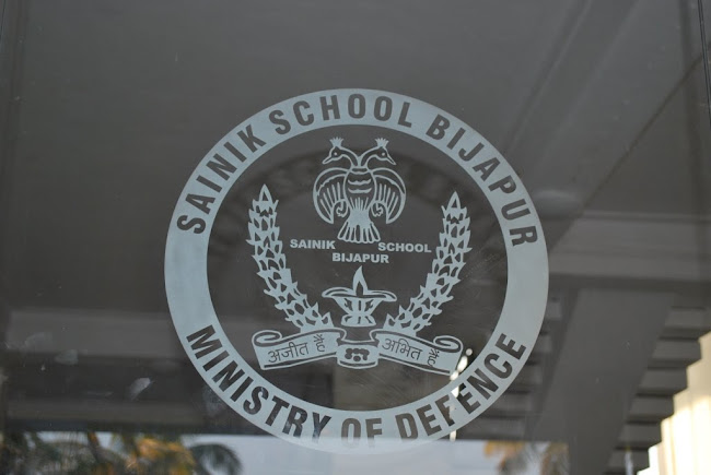 The School Emblem in the glass door of the entrance