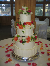 4-tier round buttercream with fondant accents