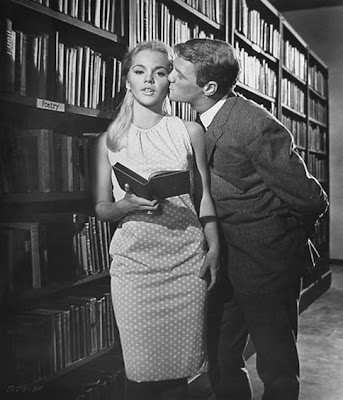 Tuesday Weld tries to read despite distractions.
