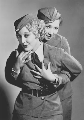 Patsy Kelly gets chummy with Thelma Todd.