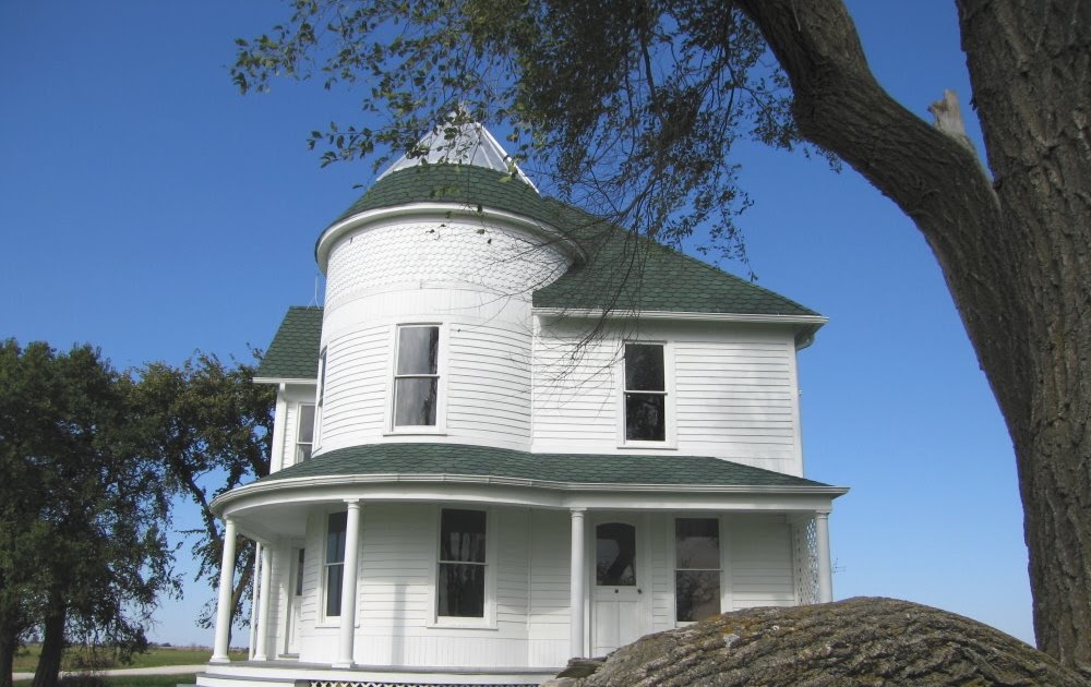 The Lucas Countyan Blue skies, round barn and an old house at Allerton