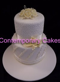2 tier extended tiers with piped cornelli work and sugar roses.