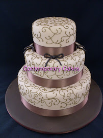 Mocca chocolate piped scrolls 3 tier stacked cake.
