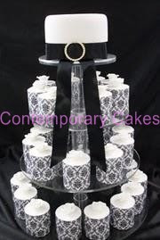 Black and white themed rose topped round miniature cakes