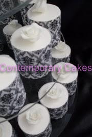 Close up of black and white theme round miniature cakes.