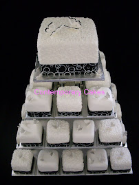 Butterfly black and white themed miniature cakes.