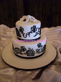 Black and white piped  design with sugar flowers
