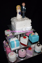 Miniature wedding cakes with personalised bride and groom toppers