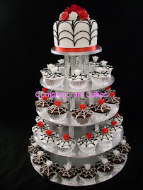 Black, red and white colur scheme, with piped spiderwebs and sugar roses.