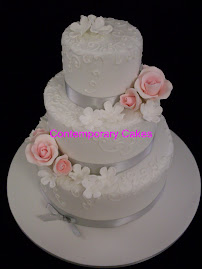 3 tier white stacked blossom and roses with piped detailing