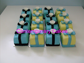 Shabby chic miniatures teal blue and black and pastel yellow and blue with a sugar rose on top.
