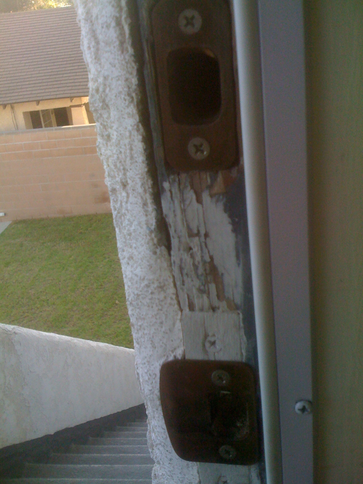 San Pedro Property 647 Stucco Caulk Needed Around the Door Frames