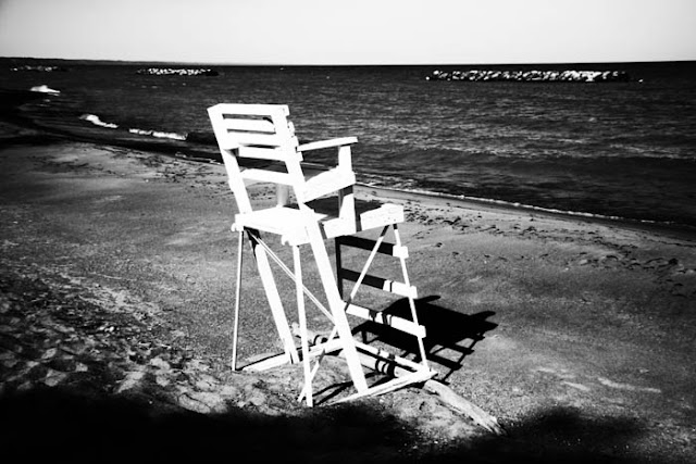 A lifeguard chair overlooking a cold and empty beach at Lake Erie in Pennsylvania.