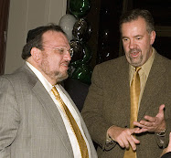 Joseph Shereshevsky, left, speaks to partner Steven Byers at an event in 2006.