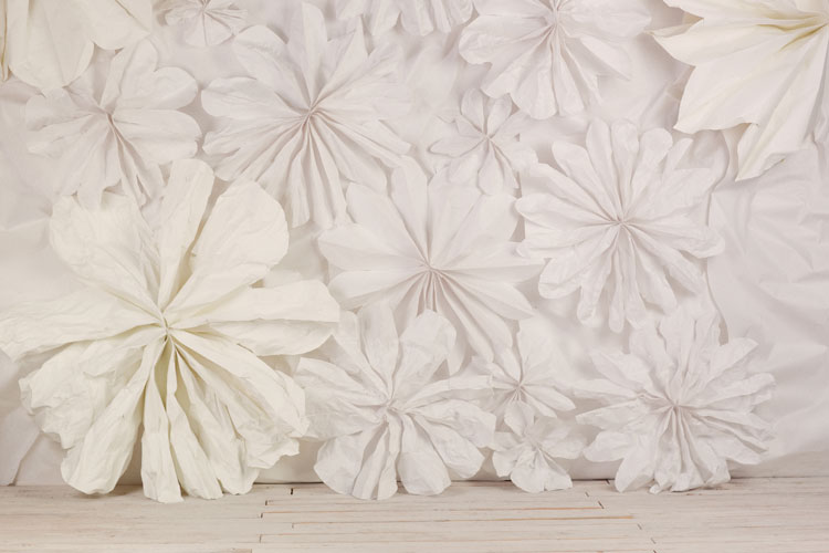 Ruche’s floral wal l with flowers made out of butcher paper
