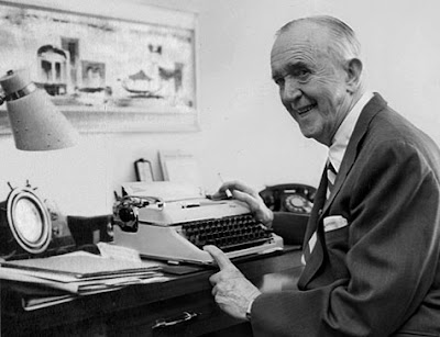 Stan Laurel at his typewriter where he composed notes to fans