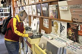 A man shops in Vinyl Junkies, a record shop in London. 