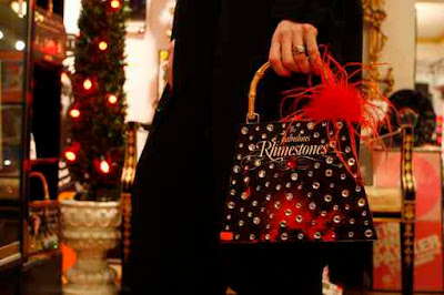 Handbags made from recylcled 45 record players or boxes and bejeweled by Max I. Million at Gold Million Rrecords.