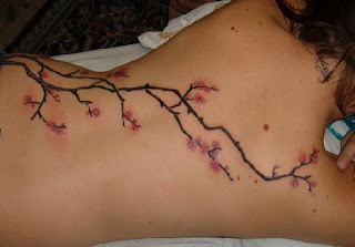 Sakura flower tattoo and art body painting