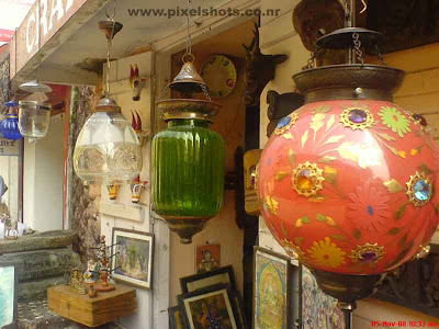 colorful candliers or lanthers hung in a shop in old jew street of cochin kerala for sale photographed