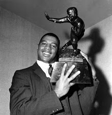 Ernie Davis with Heisman Trophy
